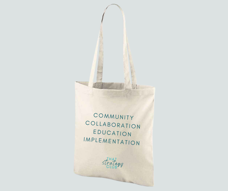 Beige tote bag with text on a light gray background