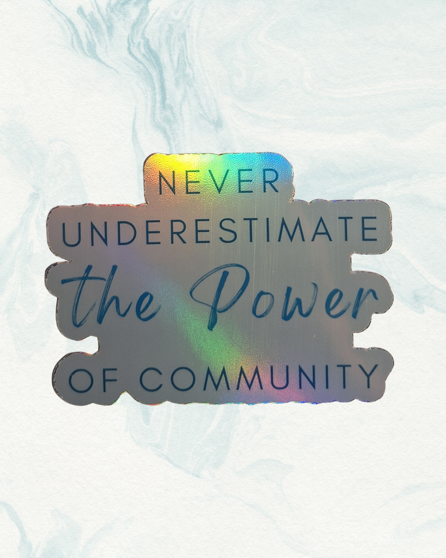 Holographic sticker with quote 'Never Underestimate the Power of Community' 